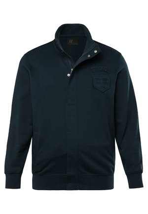 Ciemnogranatowa bluza z wysokim kołnierzem, zamkiem błyskawicznym, prążkowanymi mankietami i teksturowaną łatką z napisem "Aviation" oraz "Dayton, U.S. Ohio".