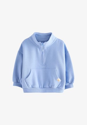 Pull polaire bleu clair pour tout-petit avec fermeture éclair à moitié sur le devant, poche kangourou, poignets et bas côtelés sur fond blanc.