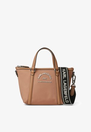 Tan leather tote bag with dual handles, a detachable strap, and white logo embroidery. Features a zip closure and contrasting black accents.