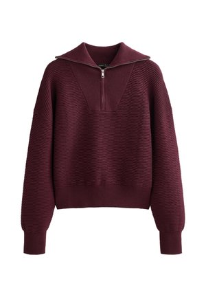 Pulover burgundy cu un design texturat cu benzi, guler înalt, închidere cu jumătate de fermoar și mâneci largi. Are un croi scurt și manșete strânse.