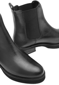 Czarne skórzane buty Chelsea z elastycznymi panelami po bokach i niskim, warstwowym obcasem, gładką fakturą i zaokrąglonym noskiem.