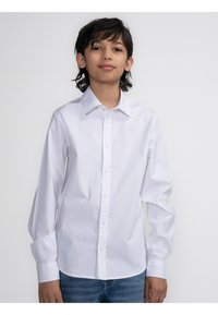 Witte lange mouwen shirt met een button-down kraag, gemaakt van gladde katoen stof, met een frontale knoopsluiting en een losse pasvorm.