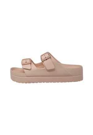 Sandali rosa chiaro con suola spessa e doppie cinghie regolabili. Realizzati in materiale morbido con una soletta testurizzata per il massimo comfort.