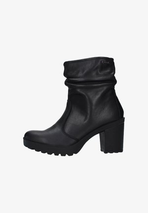 Stivale alla caviglia nero con parte superiore sbiadita, realizzato in pelle liscia. Presenta un tacco spesso e una suola testurizzata per una maggiore aderenza.