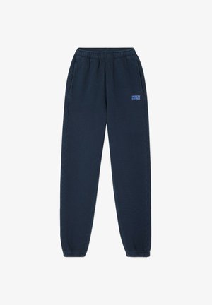 Pantalones de chándal azul marino con cintura elástica, bolsillos laterales y puños. Presenta un pequeño logotipo "AMERICAN VINTAGE" en azul claro.