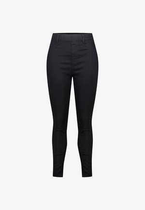 Pantalons skinny noirs taille haute avec passants de ceinture et poches avant, présentés sur un fond blanc.