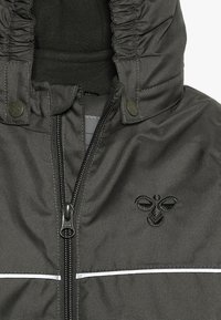 Hummel HMLSNOOPY - Kombinezon zimowy