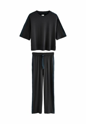 Black short-sleeve loose fit top with dark side stripes paired with matching elastic waist wide-leg pants with side stripes and front tie.