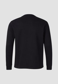 Czarna koszulka z długim rękawem wykonana z miękkiej bawełny, z okrągłym dekoltem i ściągaczami na rękawach. Gładka faktura, bez wzorów i zdobień.