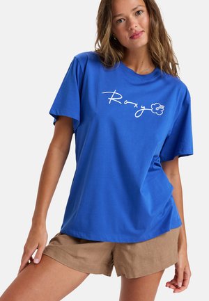 Blauwe korte mouwen T-shirt van katoen, voorzien van een wit geschreven 'Roxy' logo met een bloemenaccent. Gladde textuur en een relaxte pasvorm.