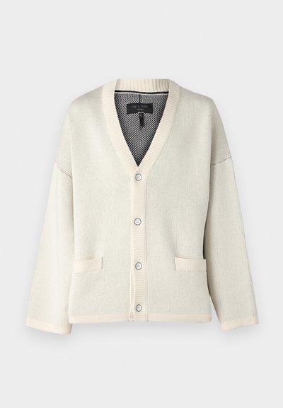 Kreemjas kardigan V-kaelusega, soonikute mansettide ja äärtega. Omab kahte esmost taskut ja viit nööpi. Pehme kudumise tekstuur.