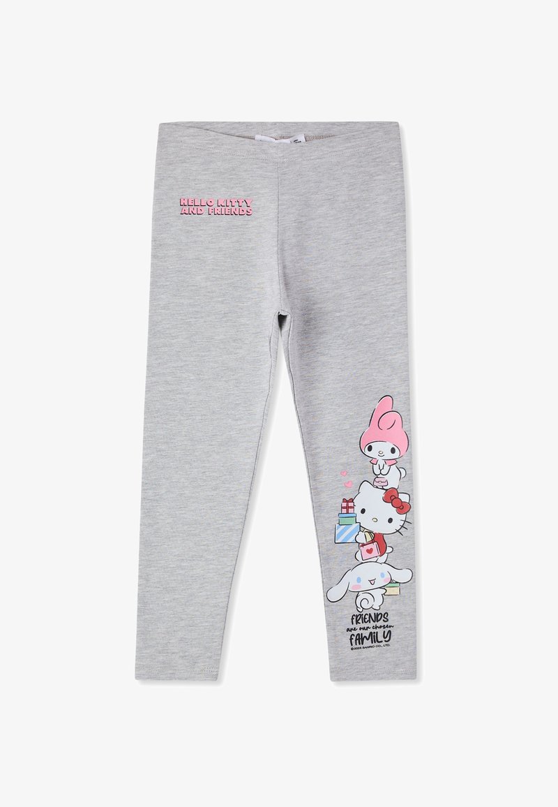 Leggings grigi chiari con il testo "Hello Kitty e Amici" sulla coscia sinistra e personaggi dei cartoni animati che tengono regali impilati sulla parte bassa della gamba destra.