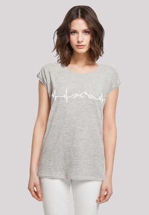 Gray short-sleeve t-shirt made of soft fabric, featuring a white heartbeat line graphic and mountain silhouette across the chest.