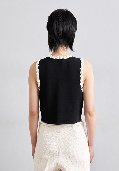 sandro CARDIGAN SANS MANCHE DETAIL GIRLY - Brezrokavnik - noir