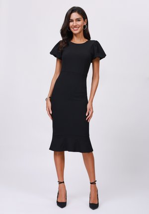 Black form-fitting dress with short puff sleeves and a flared hem. Made of a textured material, featuring a clean neckline and smooth silhouette.