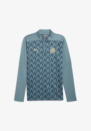Puma langærmet sweatshirt i teal, med et geometrisk mønster, halvdels lynlås krave og guld logo accenter på brystet og ærmet.