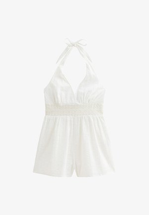Witte halterneck romper van textuurstof, met kanten rand op de taille en losse shorts. Heeft een striksluiting bij de hals.
