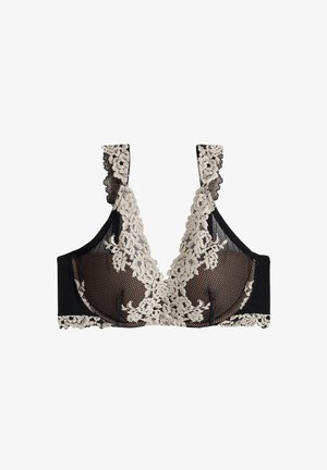 Schwarzer BH mit crèmefarbenen Spitzenverzierungen. Verfügt über ein V-Ausschnitt-Design, gewellte Träger und einen strukturierten Untergrund. Blumenspitzenverzierungen vorhanden.