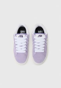 Lavender suede sneakers with white laces, round toe, padded collar, and black insoles featuring a logo. Smooth texture, minimalist design.