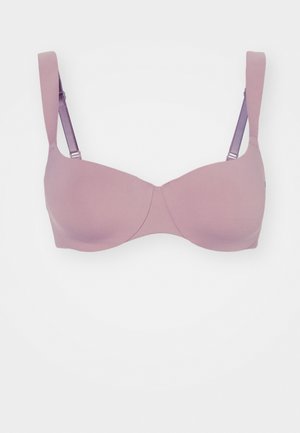 Soutien-gorge rembourré en tissu lavande doux avec des bonnets lisses, des bretelles réglables et un éclat subtil, présentant un design sans coutures.