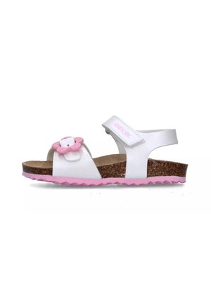 Sandalo bianco con un accento di fiore rosa, sottopiede in sughero e suola rosa in gomma con motivo a zigzag; cinturino regolabile per una vestibilità sicura.