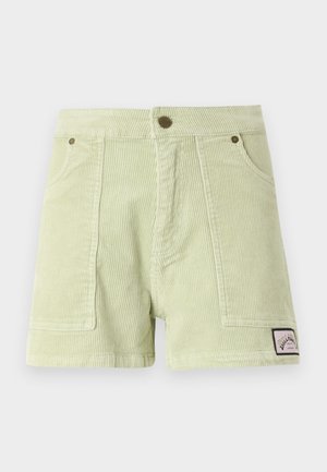 Corduroy shorts in light green, featuring a ribbed texture, two front pockets, a back patch label, and metal button hardware.