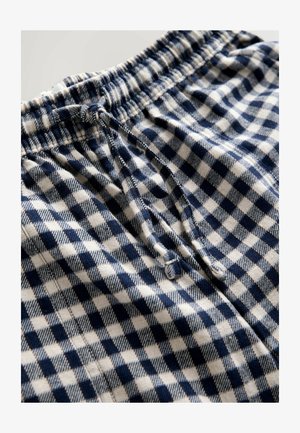 Bomuldsshorts med et marineblåt og hvidt ternet mønster. Har en elastisk linning og en snor for justerbar pasform.