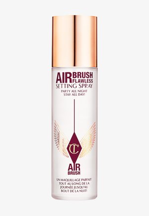 Clear glass spray bottle with a gold cap, featuring burgundy text and winged graphic on the front. Label reads "AirBrush Flawless Setting Spray."