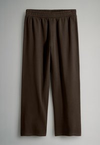 Brune, elastiske bukser med talje af blødt stof; lige ben-design uden mønstre eller udsmykning; glat tekstur.