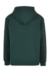 Felpa con cappuccio verde scuro, in tessuto testurizzato con polsini a costine. La vista posteriore mostra una vestibilità rilassata e dettagli di cucitura sulle spalle.