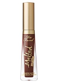 Liquid matte long-wear lipstick in dark brown shade, gold cap, with "Too Faced Melted Matte" branding on clear tapered tube.