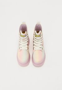Holographic ankle boots with pastel gradient colors, white laces, and a pink translucent sole. Features a logo tag on the tongue.