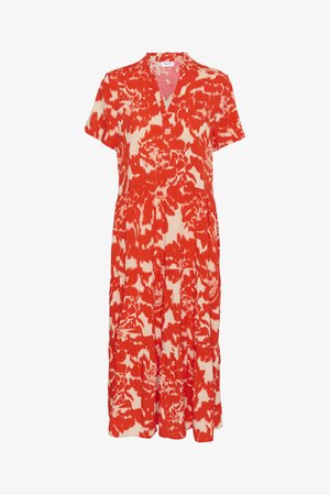 Rood en crèmekleurige jurk met bloemenprint, korte mouwen, V-hals, gelaagd ontwerp en zijzakken. Gemaakt van lichtgewicht stof.