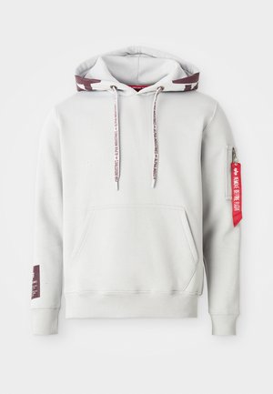 Light gray hoodie with a front pocket, adjustable drawstrings, and a side zip pocket featuring a red tag. Ribbed cuffs and hem.