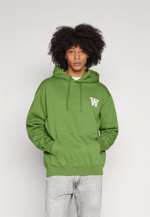 Green hoodie made of cotton blend, featuring a front kangaroo pocket, drawstring hood, and a white logo on the chest. Lightweight fabric.