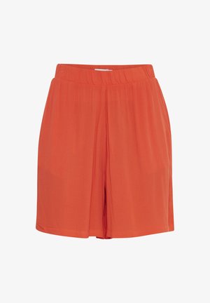 Oranžās īsās bikses, līdz ceļiem, izgatavotas no vieglas auduma ar elastīgu jostasvietu un mīkstu tekstūru, ar brīvu un plašu piegriezumu.