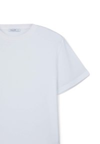 T-shirt bianco a maniche corte realizzato in tessuto morbido. Collo rotondo classico con orlo dritto e vestibilità leggermente oversize.