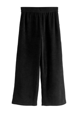Zwarte corduroy brede broek met een elastische tailleband en zijzakken. De stof heeft een ribbelstructuur en een gladde afwerking.