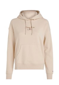 Felpa color crema in un materiale morbido con tasca frontale, cappuccio con coulisse e logo con lettering marrone sopra la tasca.