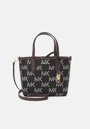 Black and brown Michael Kors tote bag with all-over MK logo print, two handles, a detachable shoulder strap, and gold MK logo charm.