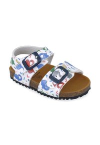 Sandalias para niños con un empeine blanco estampado que presenta ilustraciones coloridas, correas ajustables dobles, plantilla de corcho marrón y suela de goma.