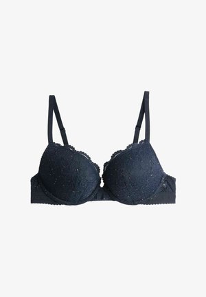 Navy blue lace bra with padded cups, scalloped edges, and adjustable straps. Features floral patterns and a textured band for support.