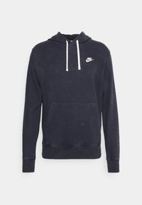 Navy blue hoodie made of soft cotton, featuring a front pocket, white drawstrings, and a small white Nike logo on the chest.