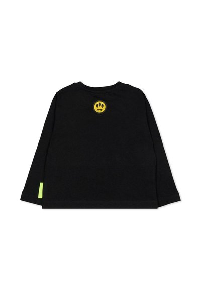 Maglietta nera a maniche lunghe in cotone con una grafica di faccina sorridente gialla e un accento verde neon sull'orlo laterale.