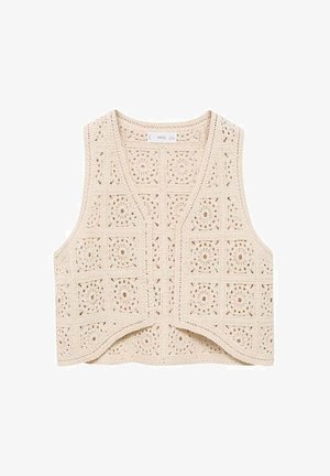 Szydełkowy kamizelka w kolorze kremowym z dekoltem w kształcie V i otwartym przodem. Posiada teksturowane wzory kwiatowe oraz falbany na brzegach. Brak zapięć.