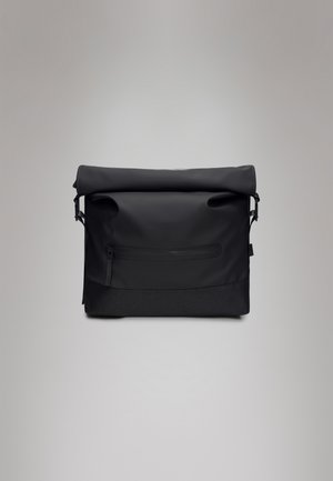 Black waterproof messenger bag with a rolled top, zippered front pocket, textured lower section, and adjustable strap.
