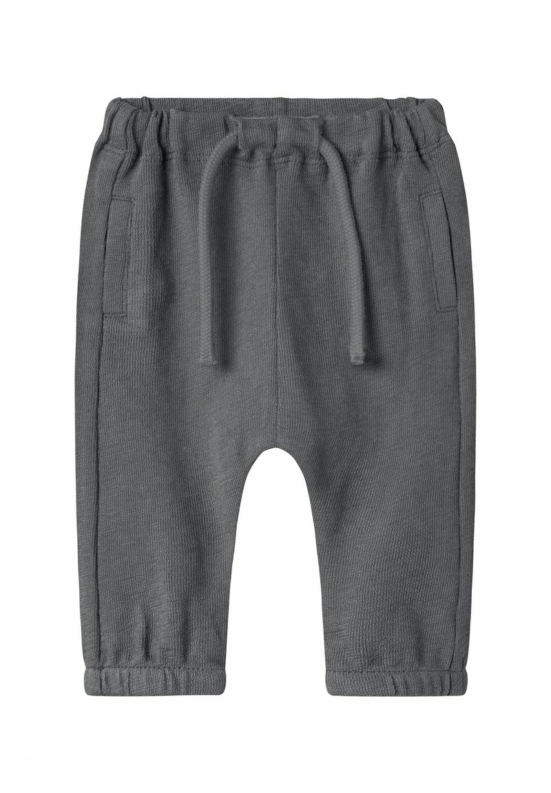 Grijze gebreide joggingbroek met een elastische tailleband, trekkoord, twee zijzakken en taps toelopende boorden. Zacht textuur en een relaxte pasvorm.