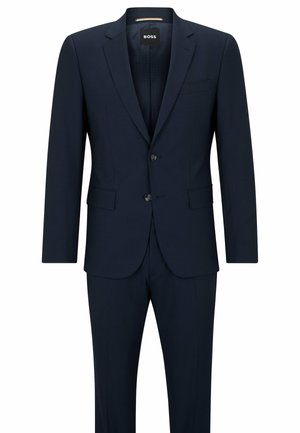Navy blue suit with a single-breasted jacket, two-button closure, and side pockets. Smooth fabric with subtle texture and tailored fit.