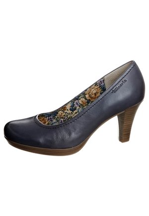 Bottine en cuir marine avec un bout arrondi, doublure en tissu floral et un talon en bois de hauteur moyenne. La tige a une texture lisse.