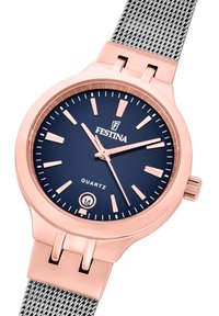 Hodinky s růžově zlatým quartzovým strojkem, námořnicky modrým ciferníkem, stříbrným síťovaným náramkem a ukazateli. Disponují datovým displejem na 6. hodině. Jednoduchý a moderní design.